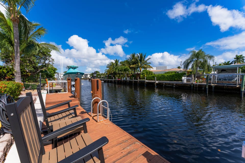 Relax on our waterfront deck, where the serene canal meets Florida's blue skies.
