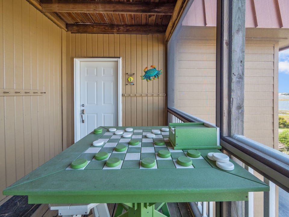Enljoy a game of checkers on our custom game table