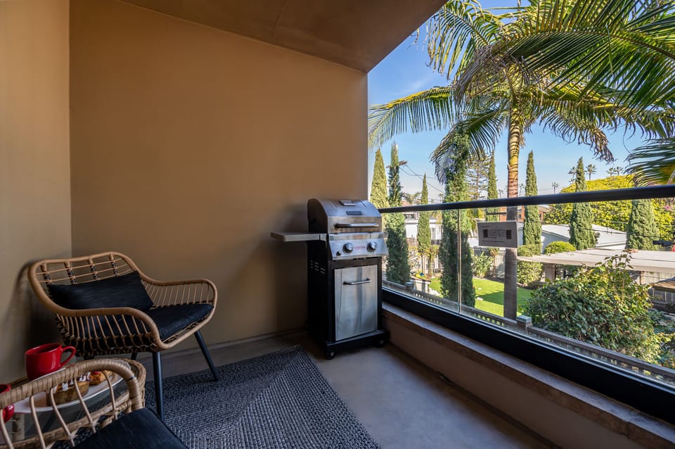 Outdoor patio located off the living room, with grill