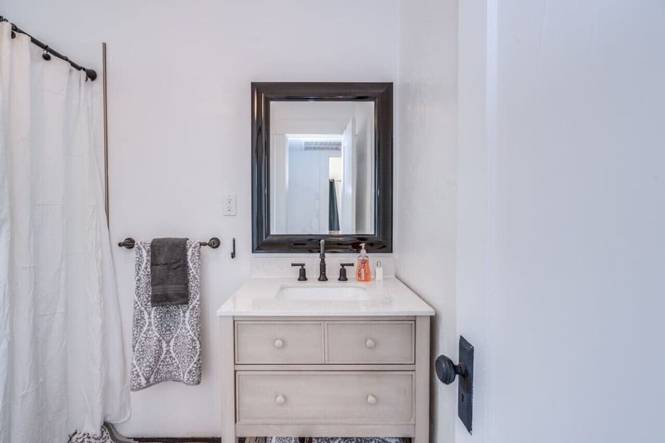 Updated bathroom with new fixtures and vanity