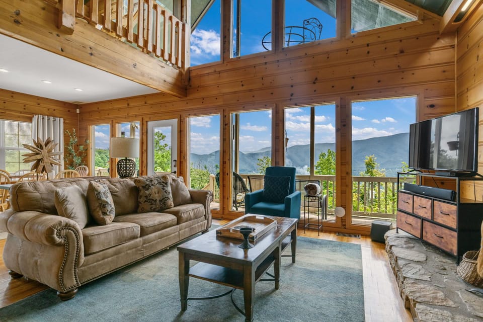 Comfort Cabin, 4 Bedrooms, Balcony, Mountain View | Living room | 75-inch TV with satellite channels, fireplace, foosball