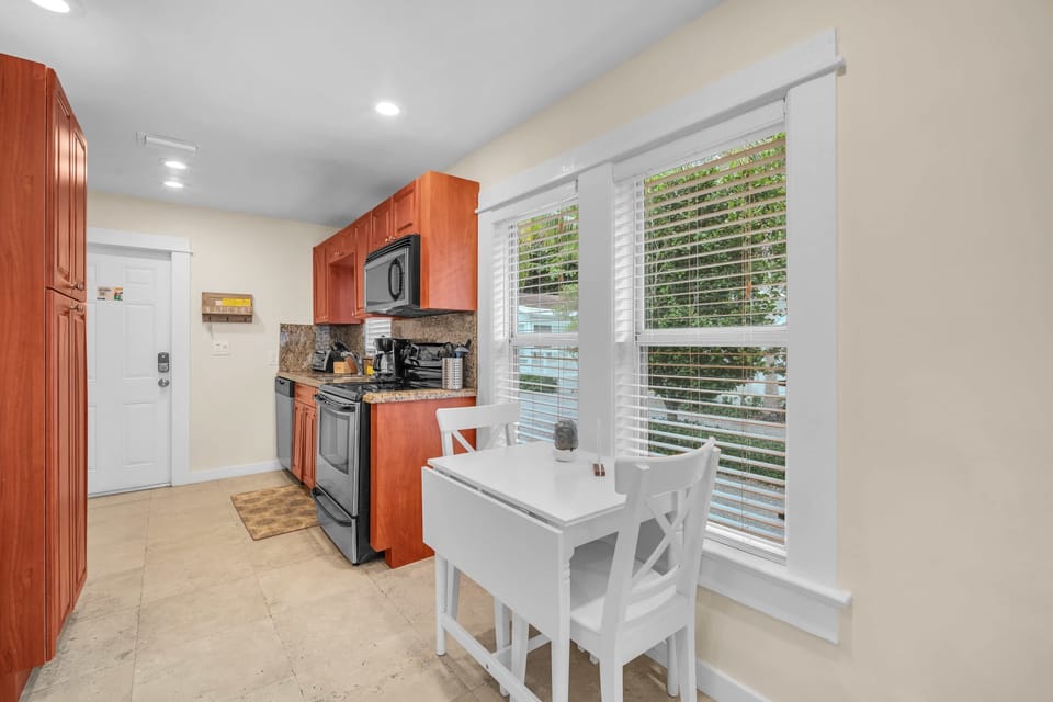Unleash your inner chef in our newly renovated kitchen, thoughtfully equipped with the essentials, a spacious full-size refrigerator, and an abundance of storage spaces.