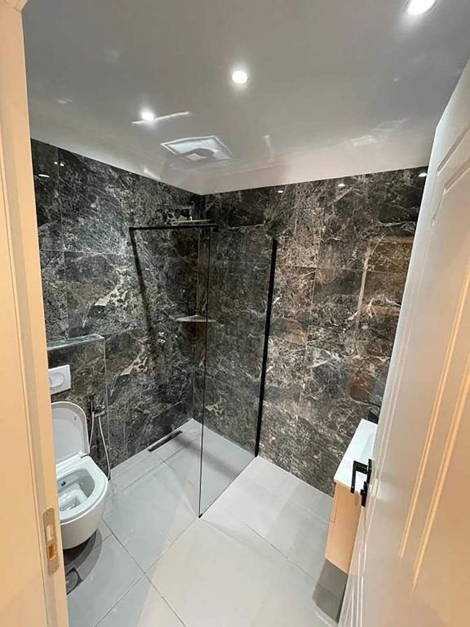 Deluxe Quadruple Room, Balcony | Bathroom | Shower, rainfall showerhead, free toiletries, hair dryer