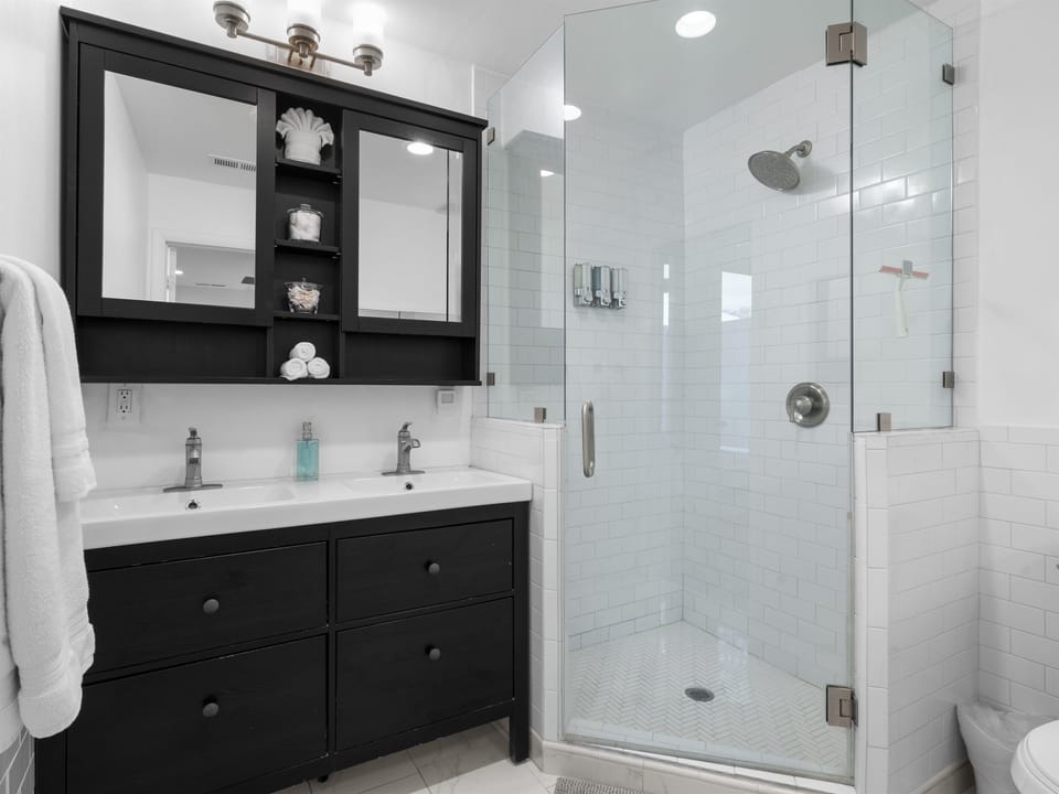Master Bathroom Equipped With Cottonballs, Q-tips, And Feminine Products