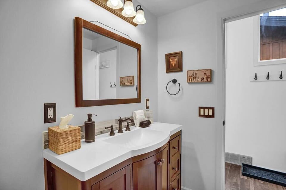 Bathroom located on the main level of the home, closest to the entrance.