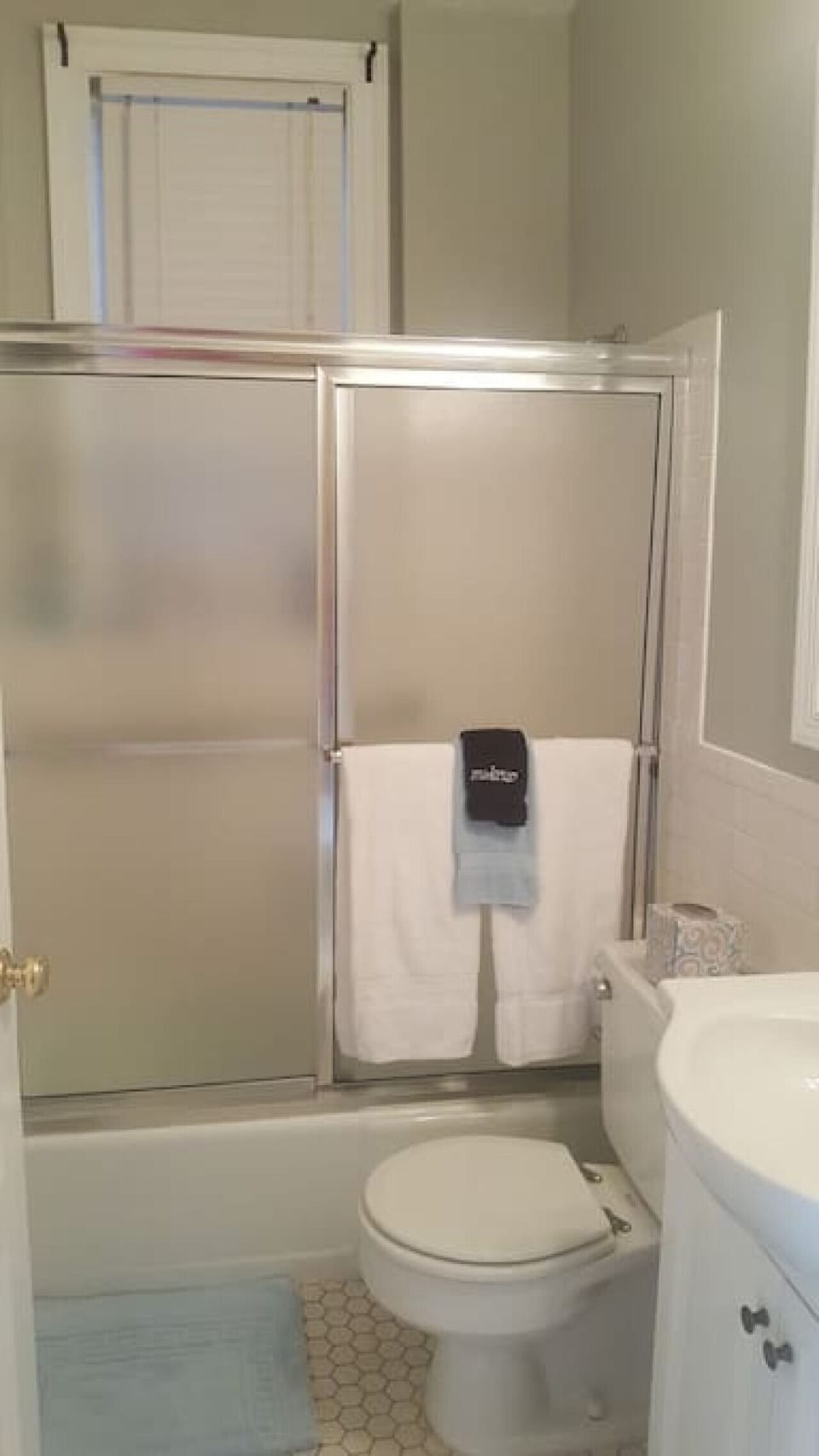 Bathroom with shower and bath tub.