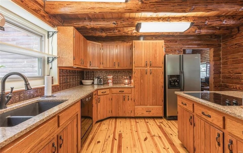 Full kitchen with modern appliances and cabinets 