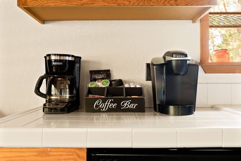 Coffee bar with a drip coffee maker and Keurig coffee maker.  All coffee, cream and sugar provided for your stay.