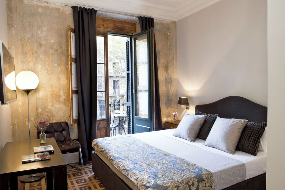Standard Double Room, Balcony, City View | Minibar, in-room safe, desk, blackout drapes