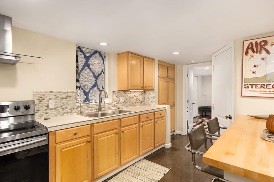 Spacious kitchen with counter seating for two.