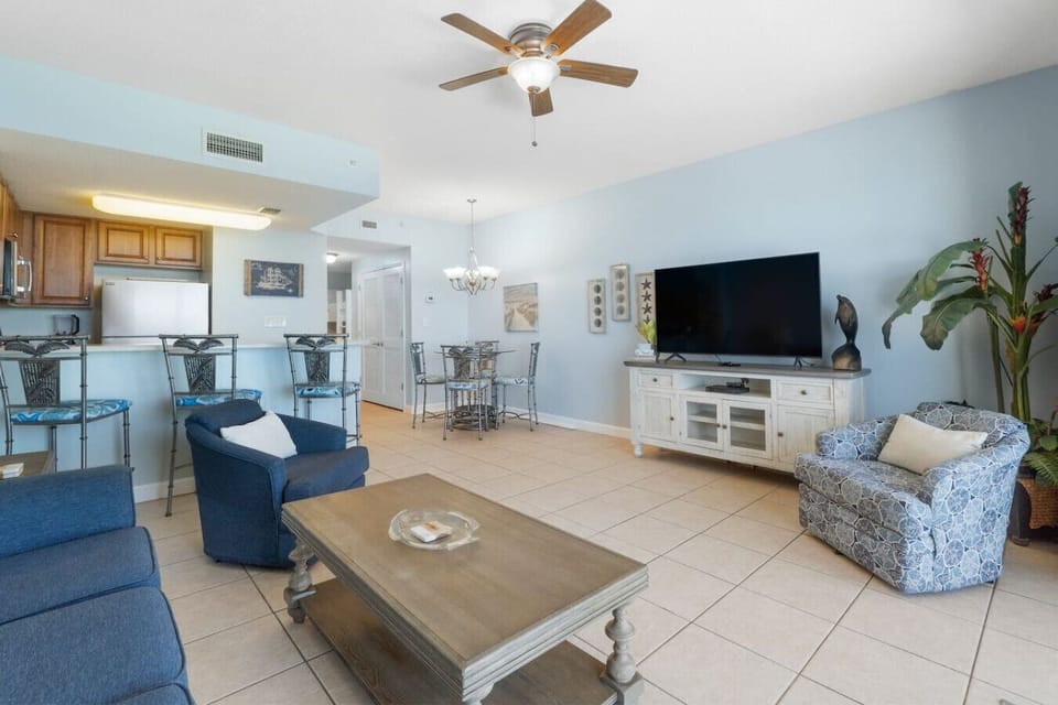 Oceanfront Living Area with Flat Screen TV, Sleeper Sofa and Private Balcony Access