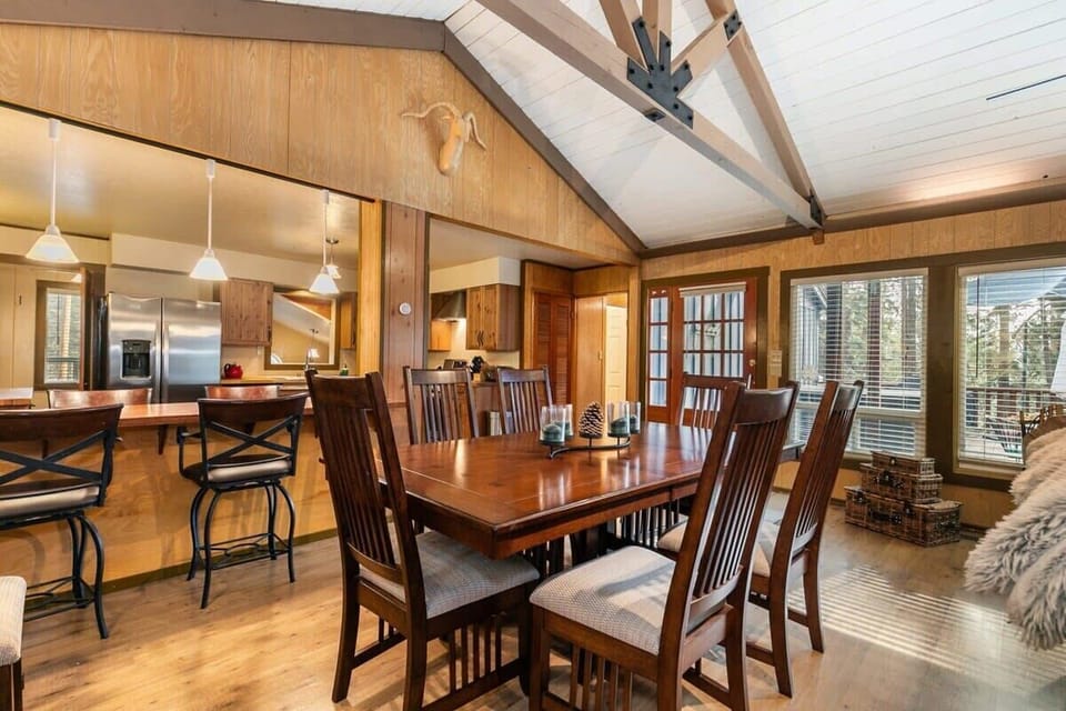 A spacious dining table with seating for 6 and a kitchen bar with 4 bar stools provide plenty of space for your group to enjoy meals together.