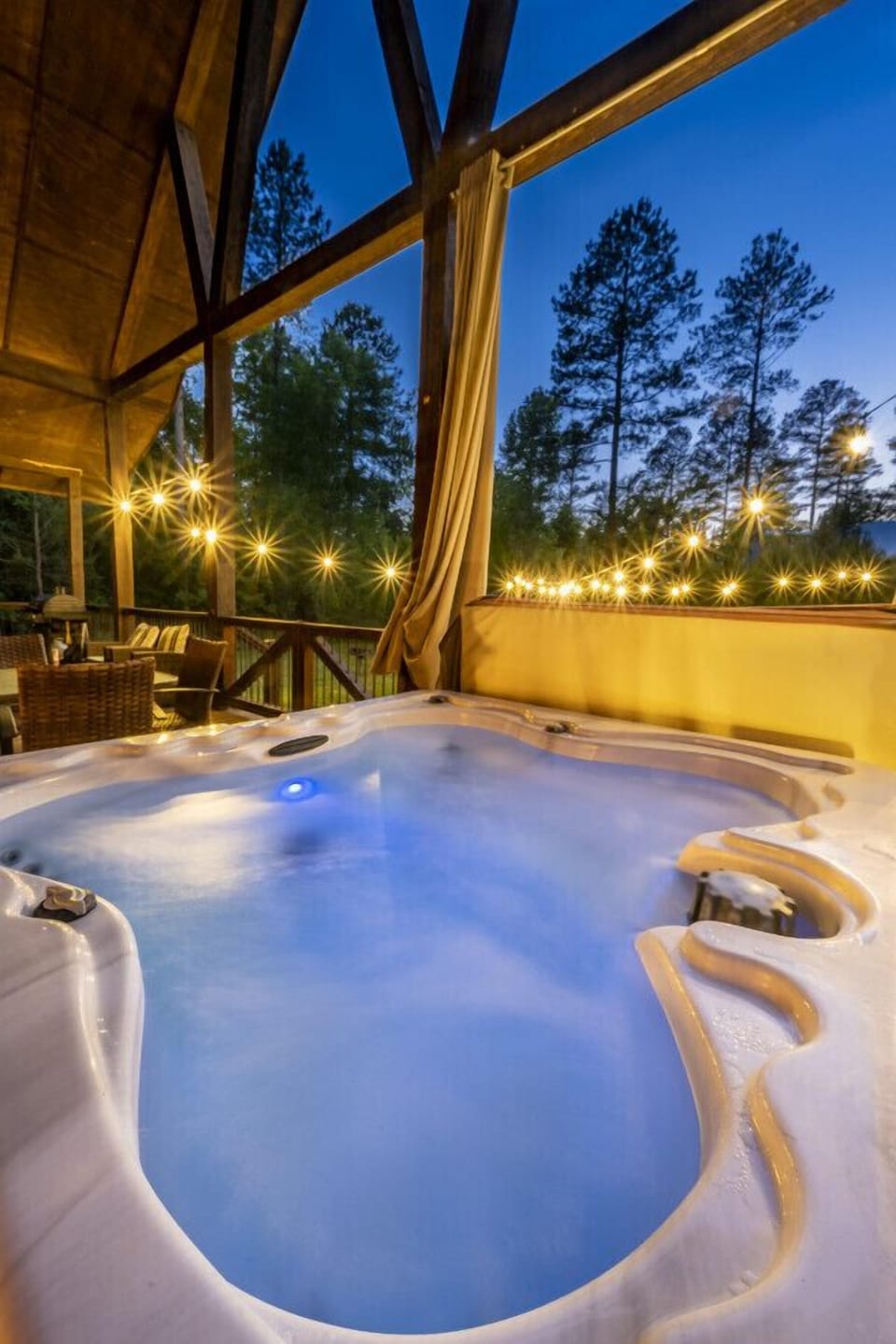 Indulge in Daydream Chalet`s hot tub oasis, where you can soak in bliss while basking in the captivating embrace of nature`s beauty.