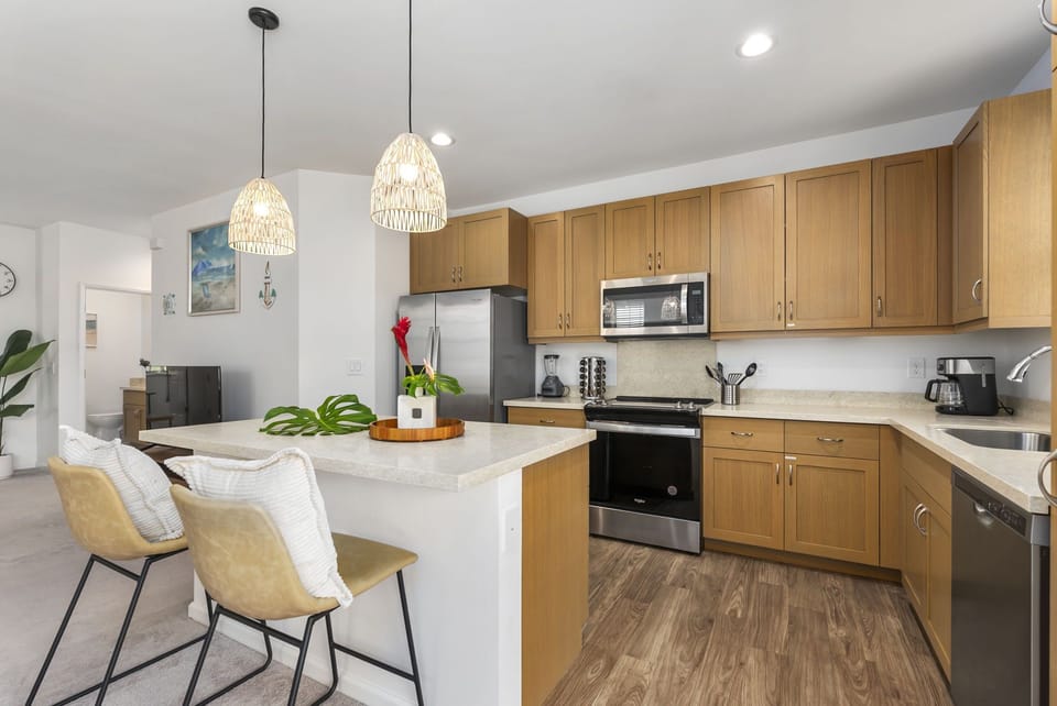 Plenty of counter space and barstool seating in the kitchen.
