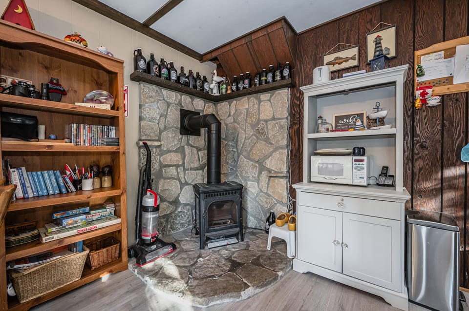The wood burning fireplace adds more warmth and atmosphere to the Barn.