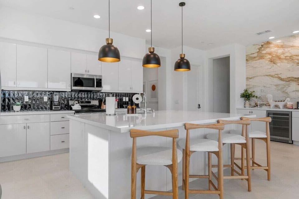 White island with natural wood stools.