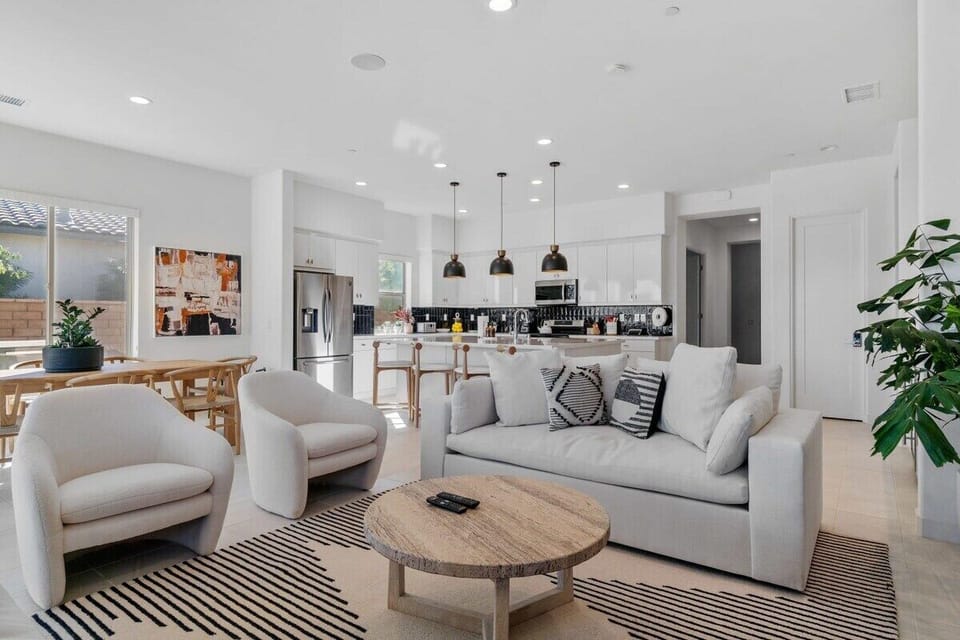 This bright living space connects seamlessly to kitchen and dining.