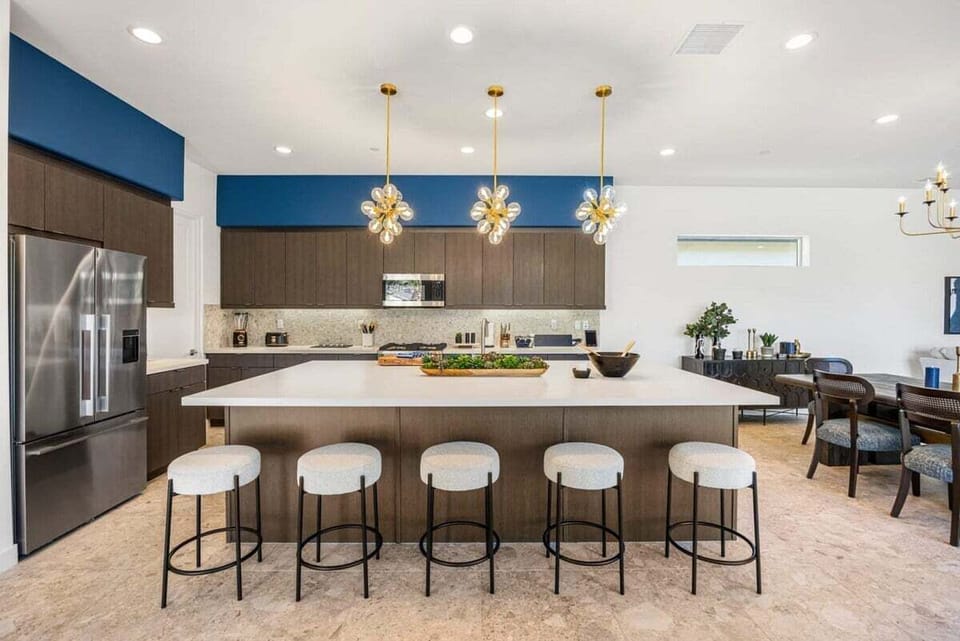 Bright, fully equipped kitchen with a breakfast bar.
