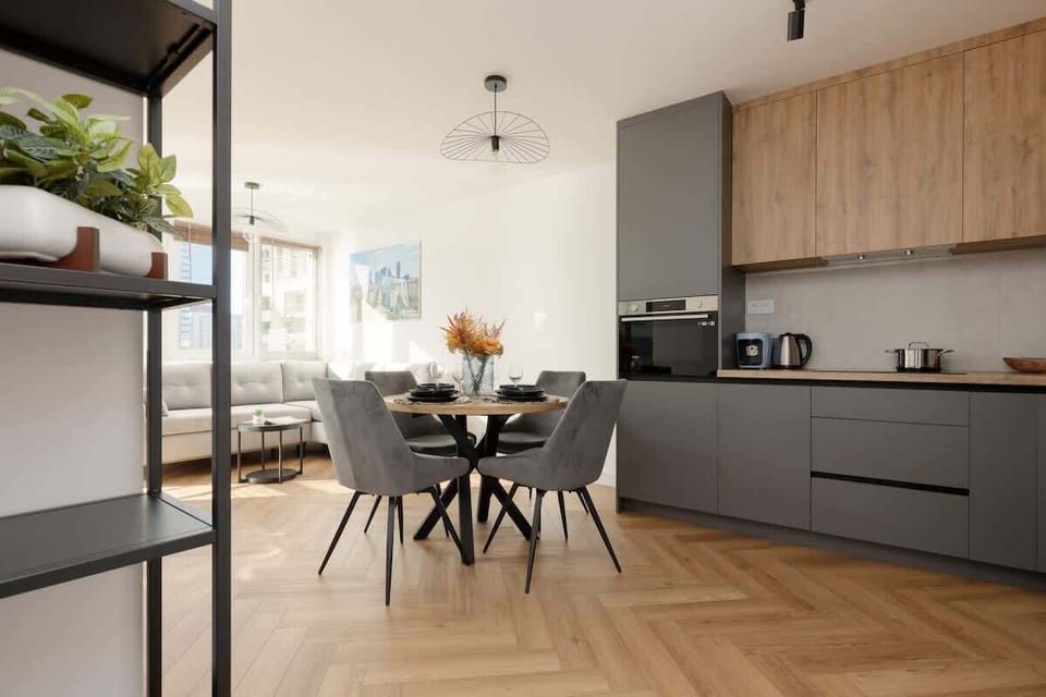 A different perspective of the open-plan space, showing the kitchen, dining, and living areas in harmony.
