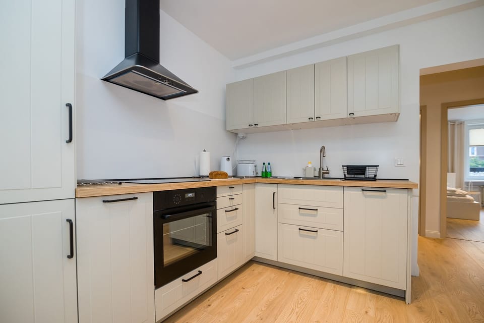 Deluxe Apartment | Private kitchen | Full-size fridge, oven, stovetop, dishwasher