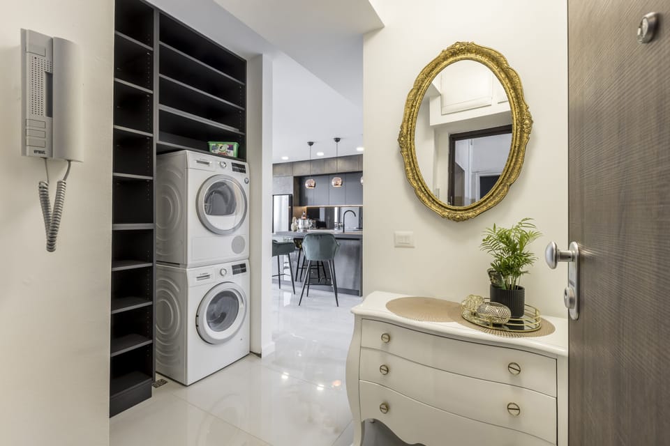 Deluxe Apartment | Living area | 100-cm LCD TV with cable channels