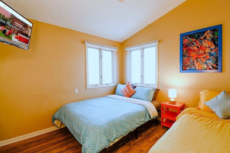 A cozy bedroom designed with soft lighting, plush bedding, and soothing colors, creating a tranquil sanctuary for rest and relaxation.