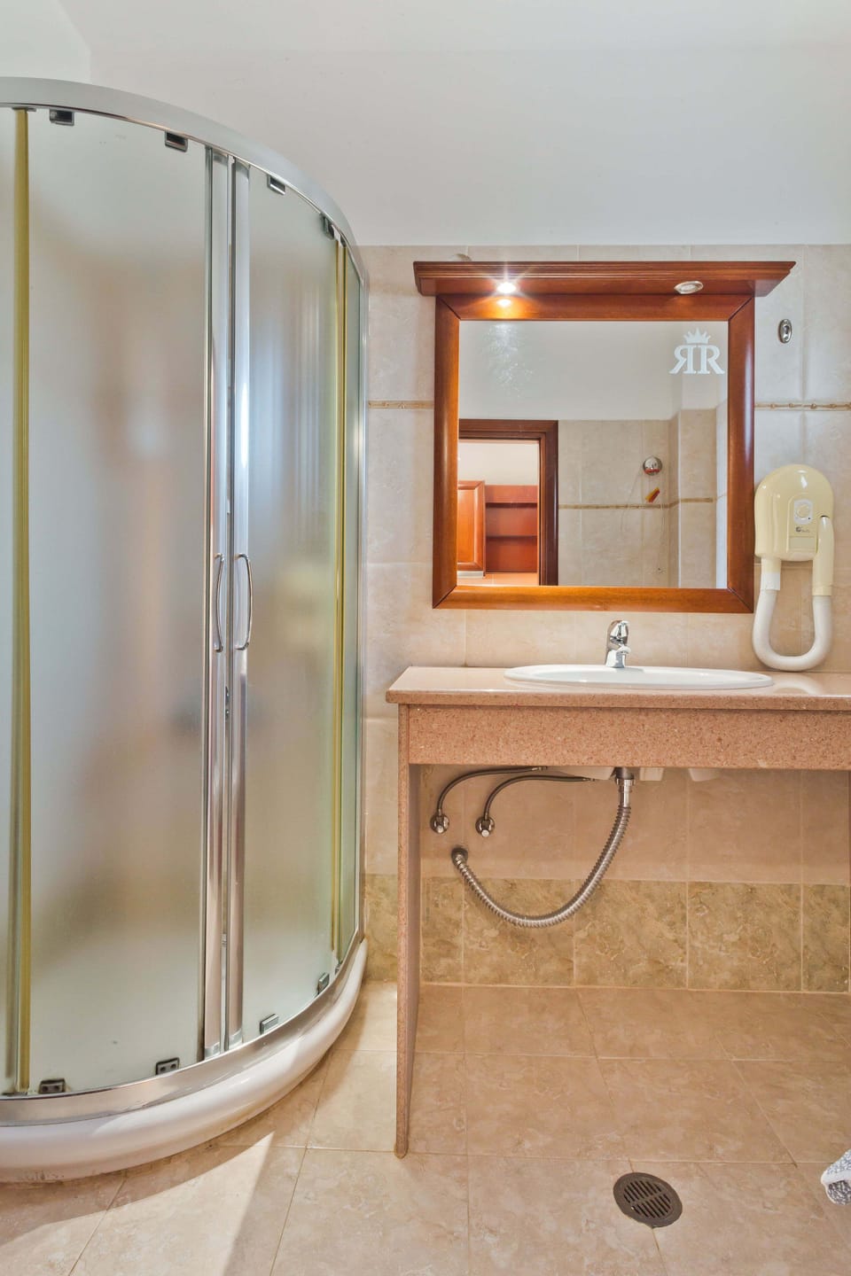 Shower, hair dryer, towels, toilet paper