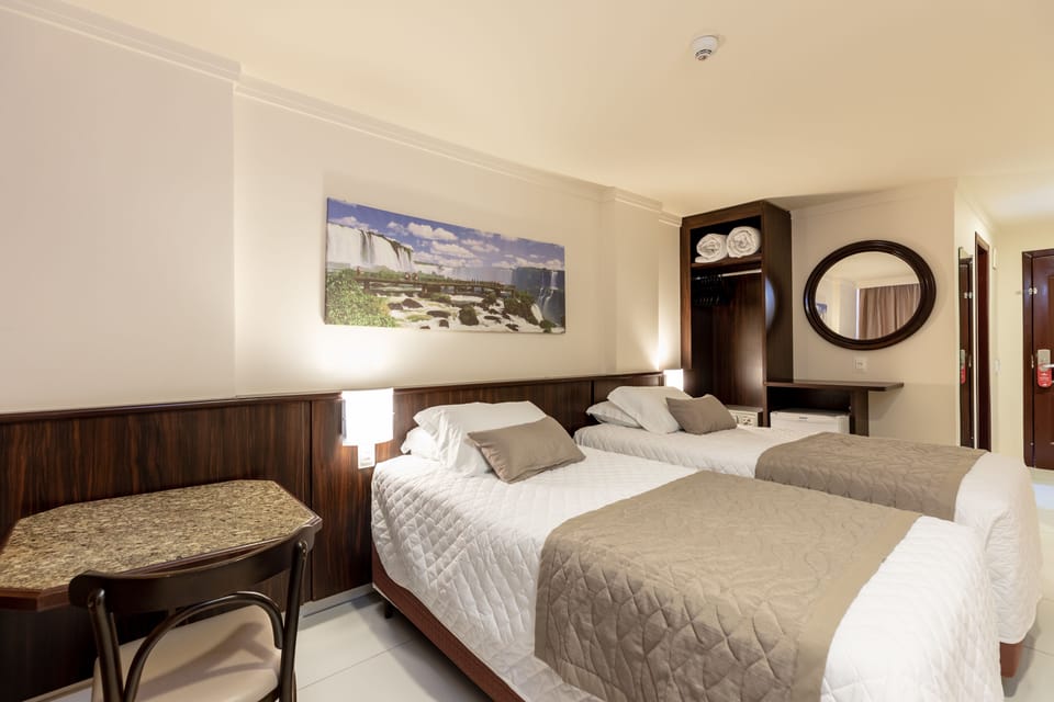 Deluxe Twin Room | Minibar, in-room safe, desk, laptop workspace