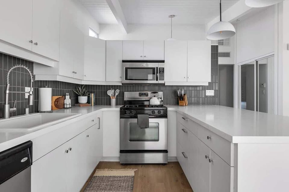 Kitchen has a microwave, utensils, dishwasher, toaster, kettle, cooking basics, and more!
