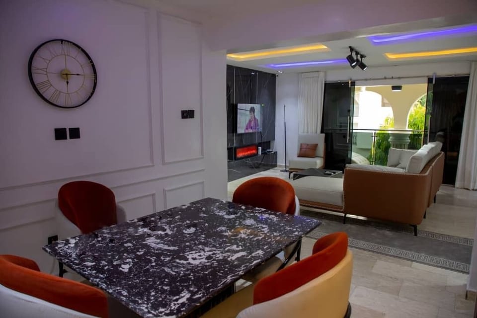 Executive Apartment | Living area | 50-inch Smart TV with satellite channels, Netflix, streaming services