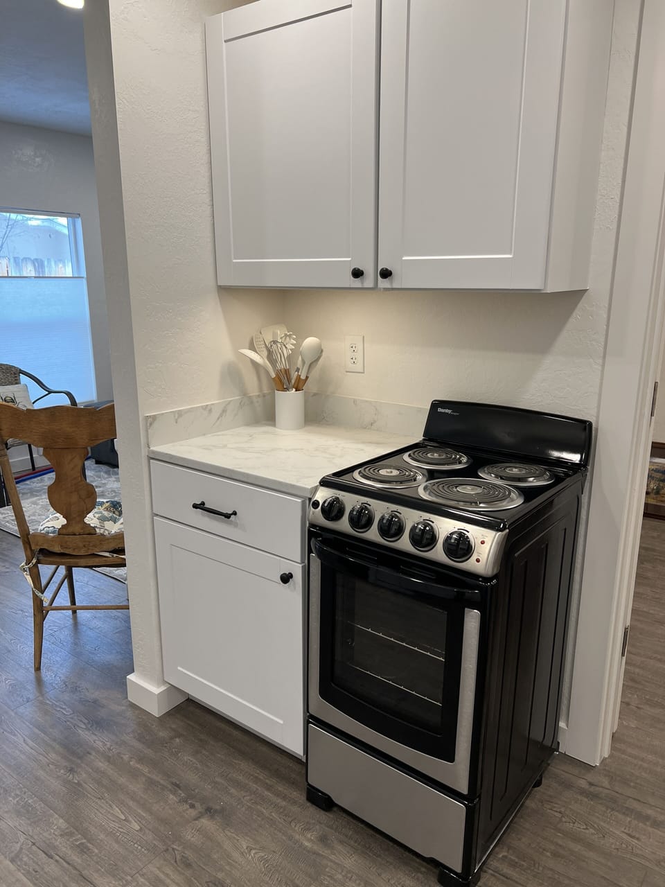 Kitchen with apartment size range.