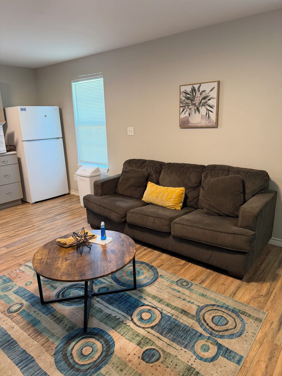 Living area with mounted big screen TV.