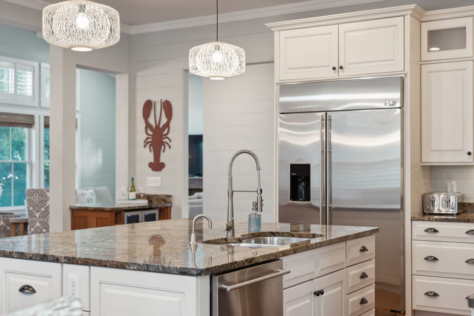 Large kitchen with stainless steel appliances.