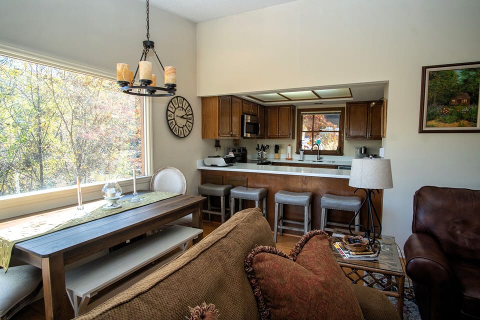Open kitchen with dining seating for informal/formal gatherings.
