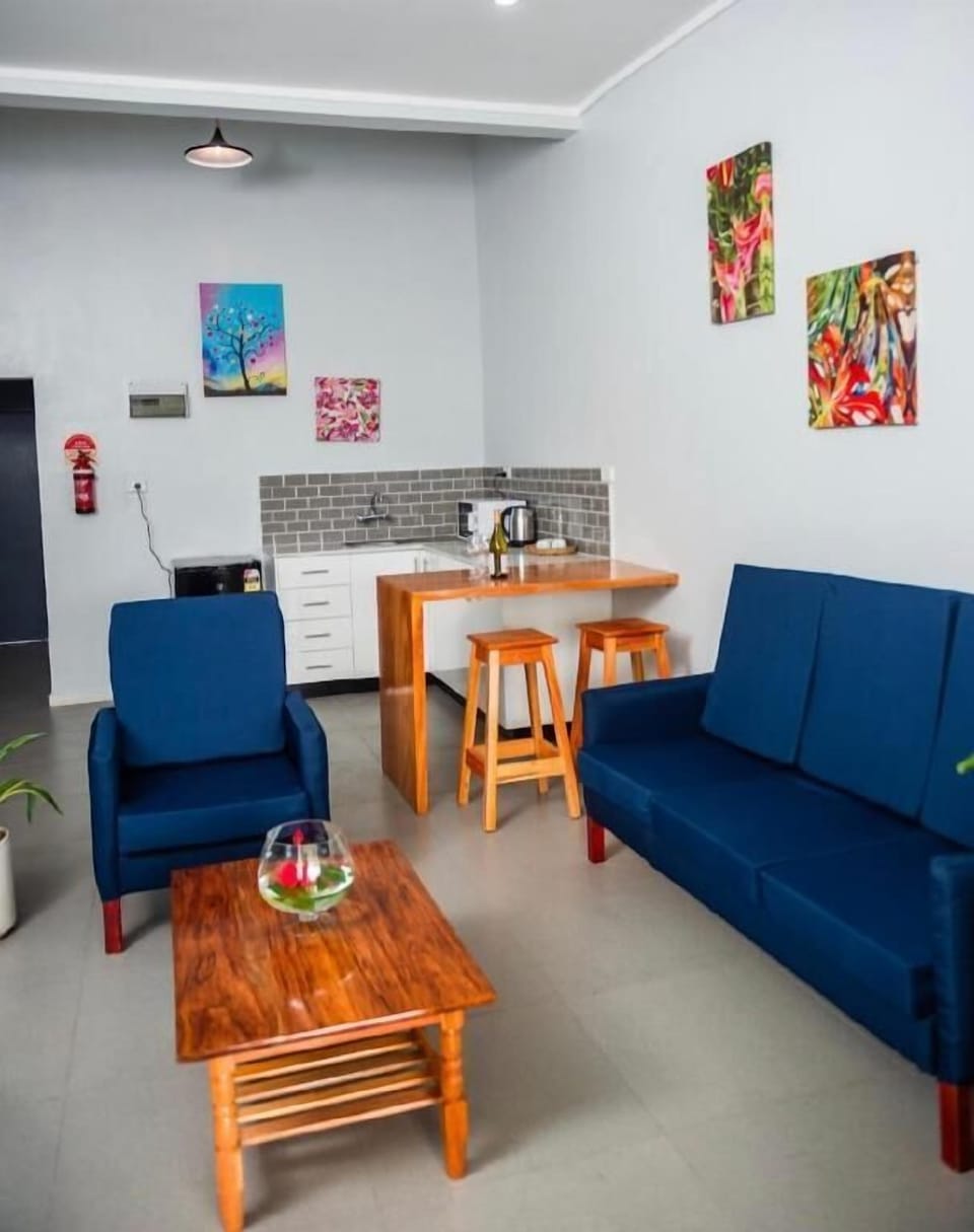 Family Deluxe Room | Living area | 32-inch Smart TV with digital channels, pay movies, streaming services