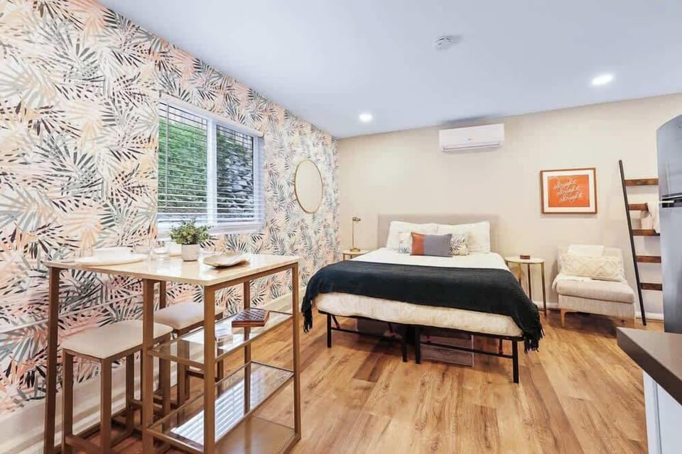 The bedroom has a queen-size bed creates a comfortable and spacious sleeping environment, offering ample room for a restful night's sleep.