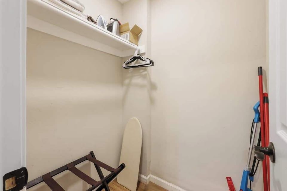 Spacious closet ( mops, vacuum and broom)