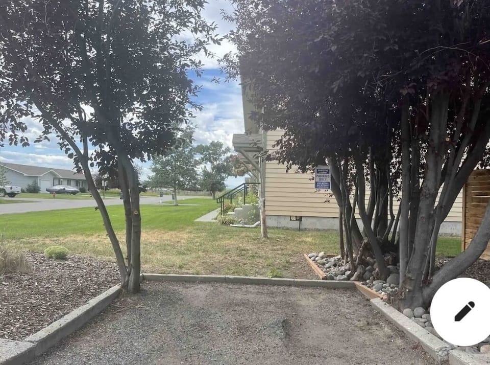 Parking Space under trees.  Additional parking off the street.