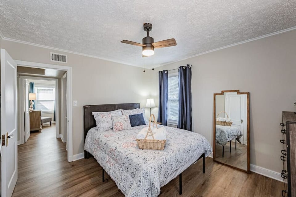 Rest easy in this first-floor retreat, featuring a queen bed, full-length mirror, ceiling fan, and a flat-screen Roku TV for ultimate relaxation.