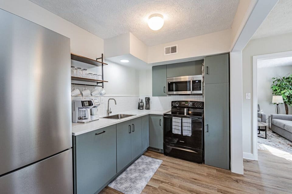 Cook with ease in this spacious kitchen, featuring a stove, built-in dishwasher, microwave, oven, toaster, Keurig & drip coffee maker, and all the essentials to whip up your favorite meals!