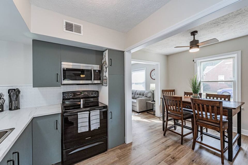 Cook with ease in this spacious kitchen, featuring a stove, built-in dishwasher, microwave, oven, toaster, Keurig & drip coffee maker, and all the essentials to whip up your favorite meals!
