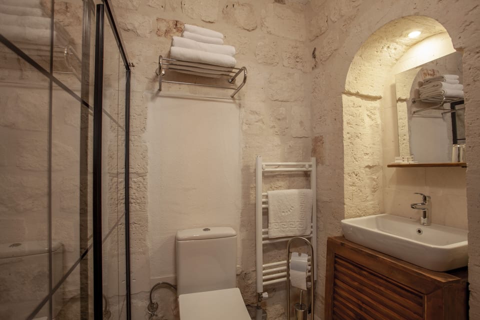 Shower, hair dryer, slippers, towels