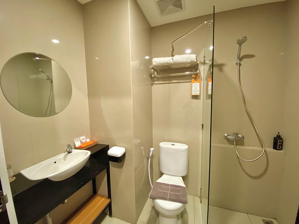 Shower, free toiletries, slippers, towels