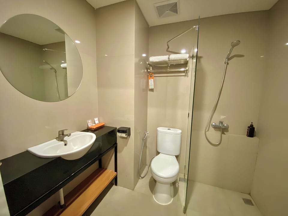 Shower, free toiletries, slippers, towels