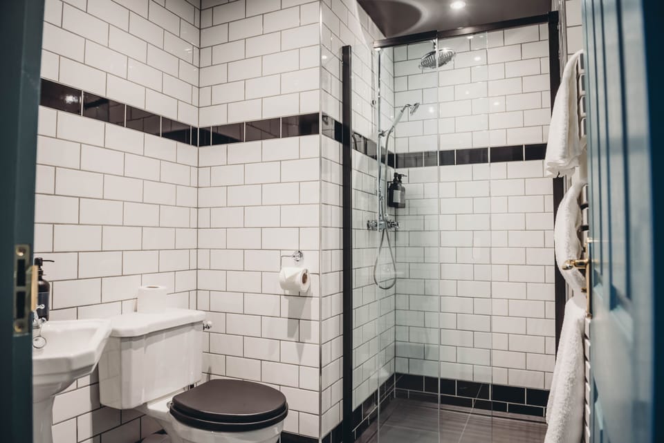 Luxury Room | Bathroom | Hair dryer, bathrobes