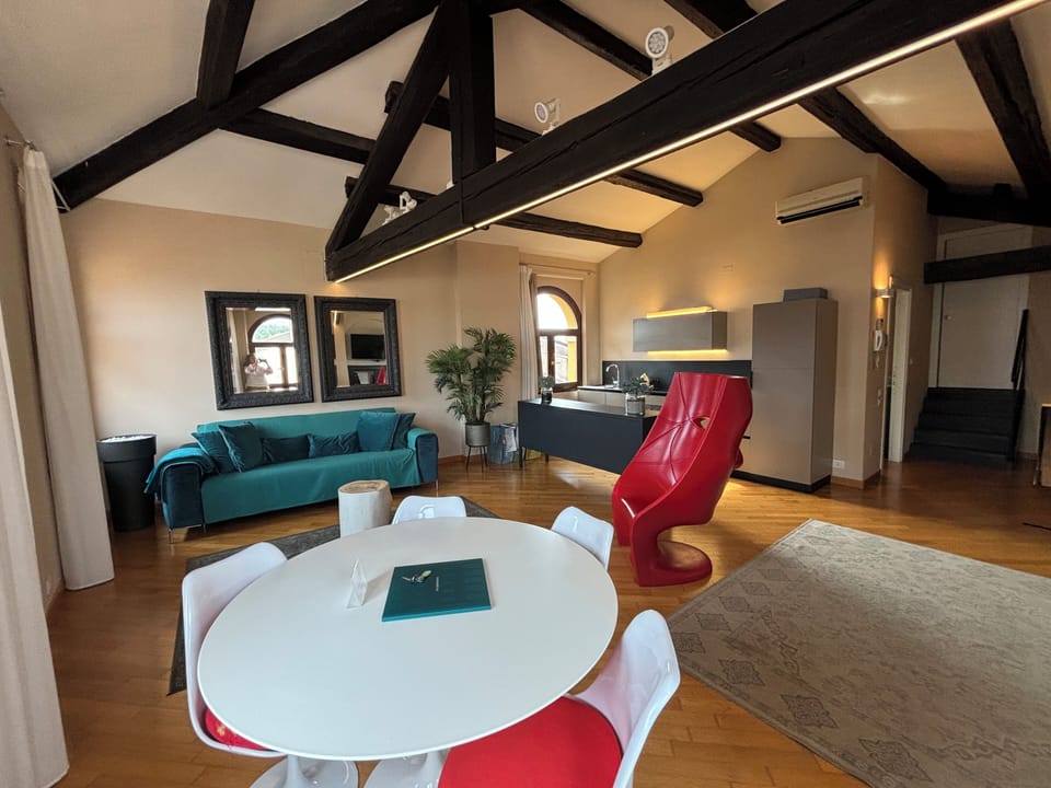 Deluxe Condo | Living area | Flat-screen TV