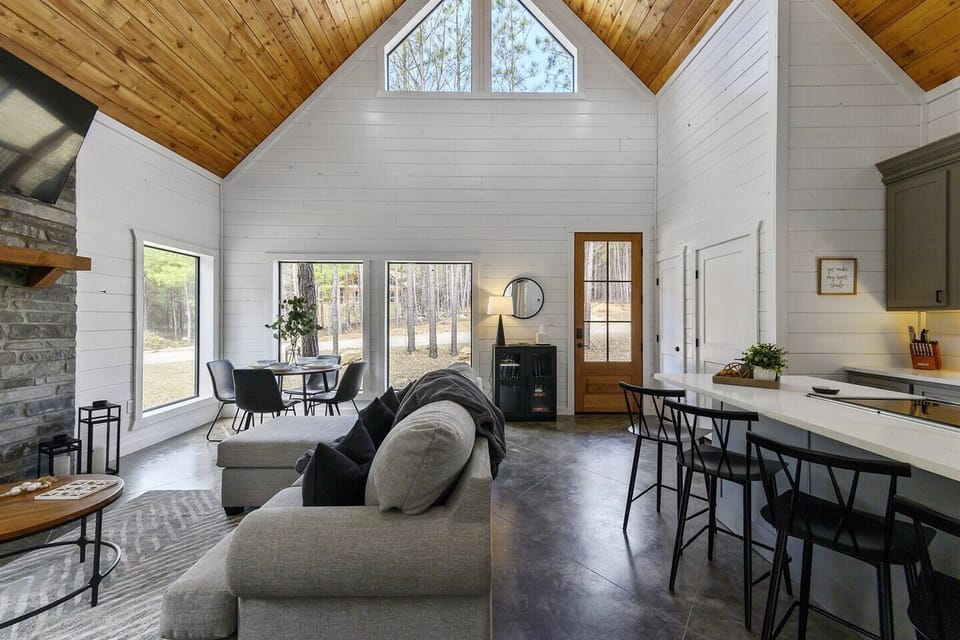 Experience modern luxury in our open-concept cabin, where natural light and elegant decor welcome you home.