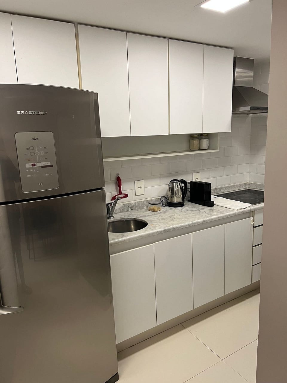 Fridge, microwave, stovetop, coffee/tea maker