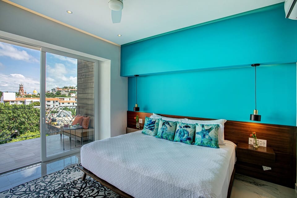 The master bedroom features a king-size bed, ensuite bathroom and breathtaking views to the city
