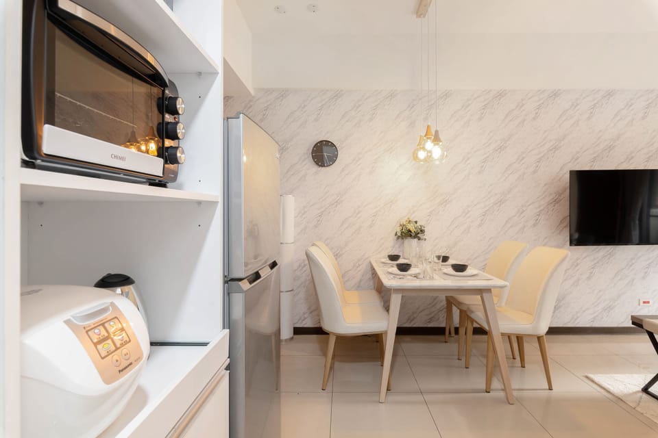 Elegant Dining Area: 
• Seating for 4 
• Open Space w/ Living Room